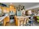 Kitchen featuring light green refrigerator, stainless steel oven, and island with bar seating at 11644 Royal Derwent Dr, Las Vegas, NV 89138