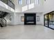 Open great room with modern fireplace and high ceilings at 19 Rue Grimaldi Way, Henderson, NV 89011