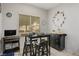 Small dining area with black table and four stools at 2429 Great Auk Ave, North Las Vegas, NV 89084