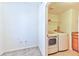 Bright laundry room, washer, dryer, and shelving at 2555 Hampton Rd # 3206, Henderson, NV 89052