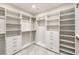 Spacious walk-in closet with white built-in shelving and gold hardware at 304 Lingering Ln, Henderson, NV 89012