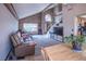 Another view of the living room with a leather sectional and a glimpse of the kitchen at 321 Simon Bolivar Dr, Henderson, NV 89014