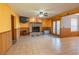 Spacious living room with tile flooring, fireplace, and double doors at 321 Simon Bolivar Dr, Henderson, NV 89014