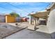 Backyard with covered patio, storage shed, and chicken coop at 325 N Minnesota St, Las Vegas, NV 89107