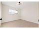 Cozy bedroom with neutral-toned carpet and a contemporary light fixture at 4222 Calimesa St, Las Vegas, NV 89115