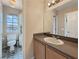 Bathroom featuring single vanity, toilet, and shower/tub combination at 504 Landra Ln, Henderson, NV 89015