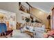 Open living room with a high ceiling, staircase, and large windows at 5163 Rudy Ln, Las Vegas, NV 89120