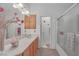 Double vanity bathroom with light wood cabinets and a shower/tub combo at 5229 Tamanar Dr, Las Vegas, NV 89130