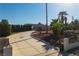 Palm trees frame a long paved driveway leading to a single-story house at 6235 Eldora Ave, Las Vegas, NV 89146