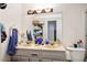 Bathroom with double vanity, marble countertop, and ample storage at 6742 Palmyra Ave, Las Vegas, NV 89146