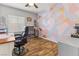 Home office with unique geometric wall design, desk, and comfortable chair at 7141 Royal Melbourne Dr, Las Vegas, NV 89131