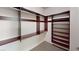 Walk-in closet with ample shelving and hanging space at 7733 Fortress Peak Ct, Las Vegas, NV 89166