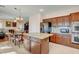 Kitchen with granite countertops and wooden cabinets at 8217 Quail Arroyo Ave, Las Vegas, NV 89131