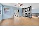 Gathering room with tile floor, built-in shelves, and a ceiling fan at 907 Royalmile Way, North Las Vegas, NV 89032