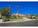 One-story house with a two-car garage and landscaped front yard at 9725 La Cienega St, Las Vegas, NV 89183