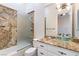 Bathroom featuring granite countertops, a glass vessel sink, and a frosted glass shower door at 10324 Summit Canyon Dr, Las Vegas, NV 89144