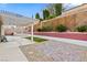 Landscaped backyard with pergola and patio at 1053 Plentywood Pl, Henderson, NV 89002