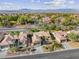 Community view showcasing single-story homes and mountain backdrop at 1461 Bonner Springs Dr, Henderson, NV 89052