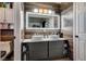 Modern bathroom with double vanity, large mirror, and wood-like wall at 1690 Autumn Rust Dr, Las Vegas, NV 89119