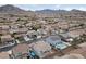 Aerial view of house with pool and solar panels, mountain backdrop at 186 Regal Sunset Ave, Henderson, NV 89002