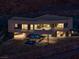 Night view of a modern home with hillside setting at 21 Rockstream Dr, Henderson, NV 89012