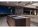 Modern kitchen island with city views at night at 21 Rockstream Dr, Henderson, NV 89012