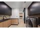 Laundry room with modern washer, dryer, and cabinetry at 21 Rockstream Dr, Henderson, NV 89012