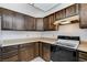 Kitchen with wood cabinets and refrigerator at 2381 Marion St, Las Vegas, NV 89104