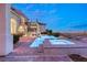 Luxury pool and spa with city views at night at 2660 Mirabella St, Henderson, NV 89052