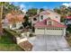 Two-story home with tile roof, attached garage, and landscaped front yard at 2848 Cape Verde Ln, Las Vegas, NV 89128