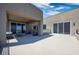 Large patio with sliding glass doors leading to the interior at 318 Shaded Canyon Dr, Henderson, NV 89012