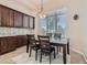 Cozy breakfast nook with dark wood cabinetry and large window at 4729 Dream Catcher Ave, Las Vegas, NV 89129