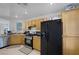 Kitchen with wood cabinets, granite counters, and stainless steel appliances at 5081 Pine Mountain Ave, Las Vegas, NV 89139