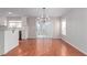 Bright dining room with hardwood floors and a modern chandelier at 5317 Welch Valley Ave, Las Vegas, NV 89131