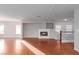 Spacious living room featuring hardwood floors and a built-in fireplace at 5317 Welch Valley Ave, Las Vegas, NV 89131