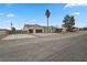 House exterior showcasing a three-car garage and mature trees at 65 Clayton St, Las Vegas, NV 89110