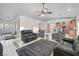 Living area with leather sofas, a view of the kitchen, and entry at 65 Clayton St, Las Vegas, NV 89110