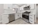 Modern kitchen featuring white shaker cabinets and stainless steel appliances at 6533 White Swan Cir, Las Vegas, NV 89108