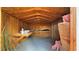 Wooden storage shed with shelving at 7309 Raincloud Dr, Las Vegas, NV 89145