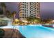 Large resort-style pool at night, with waterfall feature and view of high-rise building at , Las Vegas, NV 89109