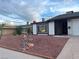 One-story home with decorative rock landscaping and a large window at , Las Vegas, NV 89147