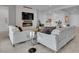 Cozy living area with fireplace, flat screen television and a wet bar in the background at 102 Appia Pl, Henderson, NV 89011