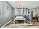 Dining room with wood table, decorative accents, and modern gray flooring at 1076 Reed Point Ct, Henderson, NV 89002