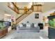 Living room with high ceilings, a staircase, and large fish tank at 1464 Briggs Ct, Las Vegas, NV 89110