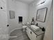 Modern bathroom with white vanity, black accents, and a tiled shower at 1830 N Buffalo Dr # 1091, Las Vegas, NV 89128