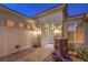 Elegant entryway with fountain, brick walkway, and ornate double doors at 1964 Oliver Springs St, Henderson, NV 89052