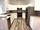 Modern kitchen with stainless steel appliances and white cabinets at 2053 Jasper Bluff St # 201, Las Vegas, NV 89117