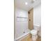 Clean bathroom with marble shower and wood-look walls at 2500 W Oakey Blvd, Las Vegas, NV 89102