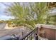 Balcony view showing trees, street, parked car, and neighboring units at 277 Melody Vista Ln, Henderson, NV 89015