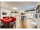 Dining area with a table and chairs, view of the kitchen and entryway at 3143 Sonata Dr, Las Vegas, NV 89121